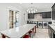 Bright laundry room with large countertop and cabinets at 5271 Isleworth Country Club Drive, Windermere, FL 34786