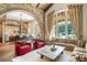 Bright living room with hardwood floors, stone fireplace, and large windows at 5271 Isleworth Country Club Drive, Windermere, FL 34786