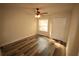 Bright bedroom featuring laminate wood flooring and ceiling fan at 7524 Seurate #12208 St # 12208, Orlando, FL 32819