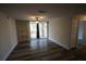 Spacious living area featuring wood-look floors and built-in shelving at 7524 Seurate #12208 St # 12208, Orlando, FL 32819