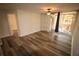 Living room with laminate floors and access to balcony at 7524 Seurate #12208 St # 12208, Orlando, FL 32819