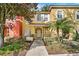 Inviting two-story townhome with attractive landscaping and a welcoming front entrance at 8443 Crystal Cove Loop, Kissimmee, FL 34747