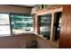 Living room with window and green blinds at 14917 Se 106Th Ave, Summerfield, FL 34491