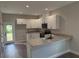 Modern kitchen with white cabinets and granite countertops at 2426 Water St, Sanford, FL 32771