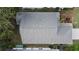 Top-down view of a house roof and landscaping at 25001 Cranes Roost Cir, Leesburg, FL 34748