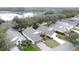 Aerial view of houses near a lake, showcasing a desirable community setting at 25001 Cranes Roost Cir, Leesburg, FL 34748