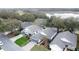 Community overview showcasing homes near a body of water and golf course at 25001 Cranes Roost Cir, Leesburg, FL 34748
