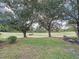 Spacious backyard with a view of a golf course at 25001 Cranes Roost Cir, Leesburg, FL 34748