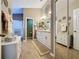 Elegant bathroom with a double vanity, a large walk-in shower, and a linen closet at 25001 Cranes Roost Cir, Leesburg, FL 34748