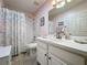 Clean bathroom with a shower/tub combo and white vanity at 25001 Cranes Roost Cir, Leesburg, FL 34748