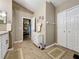 Spacious bathroom with double vanity, walk in shower, and access to bedroom at 25001 Cranes Roost Cir, Leesburg, FL 34748