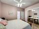 Spacious bedroom with mirrored closet doors and a comfortable bed at 25001 Cranes Roost Cir, Leesburg, FL 34748