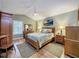 Spacious bedroom with a queen-size bed and plenty of natural light at 25001 Cranes Roost Cir, Leesburg, FL 34748