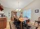 Charming dining room with wooden table, hutch, and hardwood floors at 25001 Cranes Roost Cir, Leesburg, FL 34748