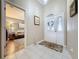 Bright entryway with tile flooring and a view into the living room at 25001 Cranes Roost Cir, Leesburg, FL 34748