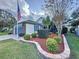 Charming single-story home with manicured lawn and brick accents at 25001 Cranes Roost Cir, Leesburg, FL 34748