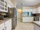 Well-equipped kitchen with stainless steel appliances and granite countertops at 25001 Cranes Roost Cir, Leesburg, FL 34748