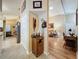 View of kitchen and adjacent living room from an interior hallway at 25001 Cranes Roost Cir, Leesburg, FL 34748
