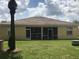 Home with a screened lanai and a large backyard at 259 Grand Rapids Dr, Poinciana, FL 34759
