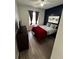 Spacious bedroom with a red blanket and a modern feel at 259 Grand Rapids Dr, Poinciana, FL 34759