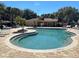 Community pool with lounge chairs and a relaxing atmosphere at 259 Grand Rapids Dr, Poinciana, FL 34759