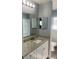 Updated bathroom with granite countertop and white cabinets at 5241 Magnolia Ter, Fruitland Park, FL 34731