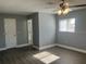 Bright bedroom featuring gray walls and wood-look flooring at 5241 Magnolia Ter, Fruitland Park, FL 34731