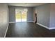 Dining room with vinyl flooring and backyard view at 5241 Magnolia Ter, Fruitland Park, FL 34731