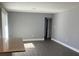 Living room with gray walls, vinyl flooring, and access to other rooms at 5241 Magnolia Ter, Fruitland Park, FL 34731