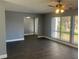 Spacious living area with large windows and gray walls at 5241 Magnolia Ter, Fruitland Park, FL 34731