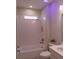 Bathroom with a shower/tub combo and updated fixtures at 573 Lago Matisse St, Kissimmee, FL 34759