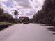 Gated community entrance with palm trees at 573 Lago Matisse St, Kissimmee, FL 34759