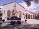 Elegant fountain with blue accents in a Spanish-style courtyard at 573 Lago Matisse St, Kissimmee, FL 34759