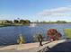 Serene lake view with fountain and lush landscaping at 573 Lago Matisse St, Kissimmee, FL 34759