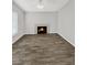 Living room featuring a fireplace and wood-look tile floors at 105 Northlake Dr # 105, Sanford, FL 32773