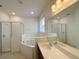 Main bathroom with soaking tub, shower, and double vanity at 2553 Shanti Dr, Kissimmee, FL 34746