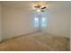 Spacious bedroom with neutral carpeting and window coverings at 2553 Shanti Dr, Kissimmee, FL 34746