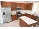 Modern kitchen with stainless steel appliances and an island at 2553 Shanti Dr, Kissimmee, FL 34746