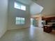 Open kitchen and dining area with stainless steel appliances and tile floors at 2553 Shanti Dr, Kissimmee, FL 34746