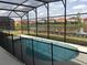 Screened-in pool with lake view at 2553 Shanti Dr, Kissimmee, FL 34746