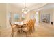 Bright dining room with a wood table and chairs, chandelier at 256 Largo Dr, Kissimmee, FL 34759