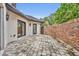 Spacious patio with brick wall and French doors leading to the interior at 333 N Spaulding Cv, Lake Mary, FL 32746