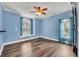 Bright bedroom with hardwood floors, window seat, and light blue walls at 333 N Spaulding Cv, Lake Mary, FL 32746