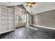 Large bedroom with built-in bookshelves and dark hardwood floors at 333 N Spaulding Cv, Lake Mary, FL 32746