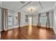 Large bedroom with hardwood floors, and French doors leading to the patio at 333 N Spaulding Cv, Lake Mary, FL 32746