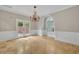 Bright dining room features a chandelier and French doors leading to a patio at 333 N Spaulding Cv, Lake Mary, FL 32746