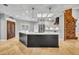 Modern kitchen with a large island, stainless steel appliances, and white cabinetry at 333 N Spaulding Cv, Lake Mary, FL 32746