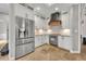 Modern kitchen features stainless steel appliances and white shaker cabinets at 333 N Spaulding Cv, Lake Mary, FL 32746