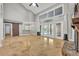 Open living space with high ceilings, tile floors, and a fireplace at 333 N Spaulding Cv, Lake Mary, FL 32746
