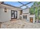 Relaxing patio with fireplace and brick flooring adjacent to the pool at 333 N Spaulding Cv, Lake Mary, FL 32746